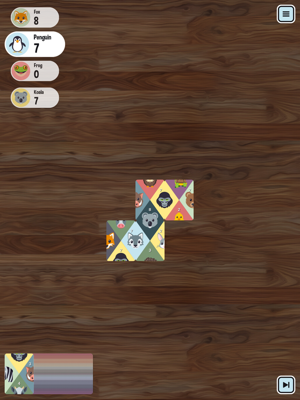 Matchimals on iPad: the first cards of a game on the wooden table
